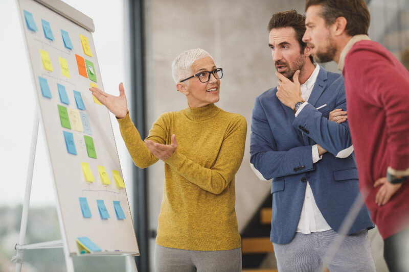 Brand strategist presenting a positioning framework to a client team