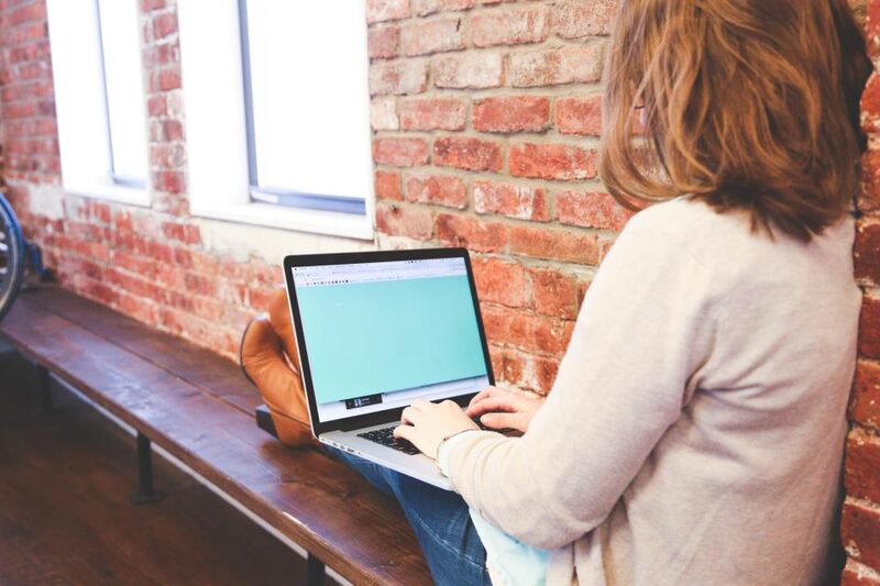 Marketing specialist working through a list of new Detroit sales leads