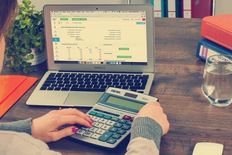 Reviewing monthly marketing spend and cost per acquisition figures