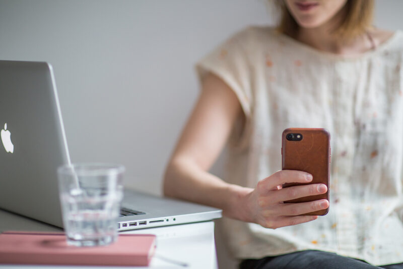 Business owner taking a customer call from a cloud VoIP phone system
