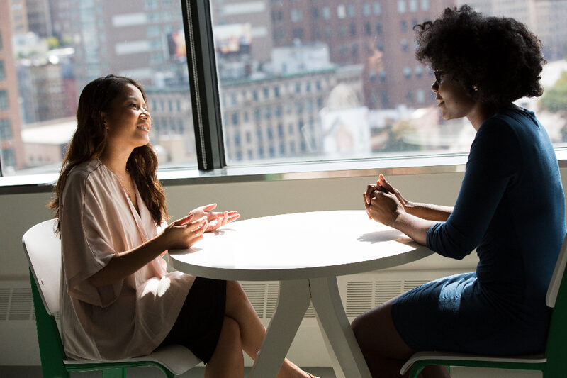 Consultant walking a Detroit business owner through the customer journey
