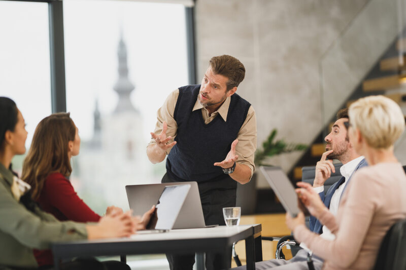 Sales consultant coaching a Detroit team through a pipeline review